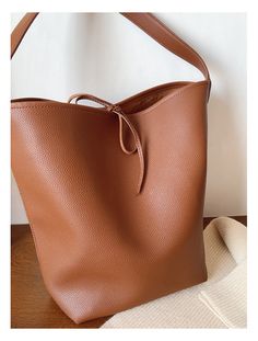 2024 New style. Simple leather bucket bag. Material: PU Leather Size: 14.1"H x 15.7"W x 5.9"D Extra crossbody strap Designer Style ID: 8771 Chic Bucket Leather Bag with Shoulder Strap and Inner Pouch, Women's Everyday Handbag Luxury Pebbled Leather Bucket Shoulder Bag, Luxury Black Woven Leather Bucket Bag, Everyday Handbag, Simple Leather, Chic Leather, Raffia Bag, Leather Bucket Bag, Leather Bucket, Designer Style