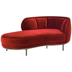 a red couch sitting on top of a metal frame