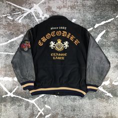 "This is used item , please don't expected it to be like \"new\" or in \"pristine\" condition, Thank You. MEASUREMENT Pit to pit : 26 inches Length : 26 inches Shoulder : 23 inches Sleeve : 22 inches Condition : 8/10" Hooded Embroidered College Varsity Jacket, Hooded Embroidered Varsity Jacket For College, Embroidered Hooded Varsity Jacket For College, Vintage Winter Outerwear With Embroidered Graphics, Retro Embroidered Outerwear For Streetwear, Vintage Outerwear With Patches For College, Vintage College Outerwear With Patches, Vintage Outerwear With Embroidered Patch For Streetwear, Retro Outerwear With Embroidered Patch And Long Sleeves