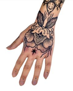 a person's hand with a tattoo on it and an image of a clock