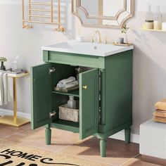 a bathroom with a sink and green cabinet