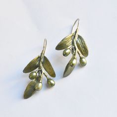 Olive Leaf Drop Earrings - Goldmakers Fine Jewelry Artisan Green Brass Earrings, Green Brass Earrings Nature-inspired, Nature-inspired Bronze Earrings For Gifts, Green Hand Forged Brass Earrings, Hand Forged Green Drop Earrings, Green Oxidized Drop Earrings, Unique Hand Forged Green Earrings, Artistic Green Metal Earrings, Green Oxidized Finish Earrings For Gift