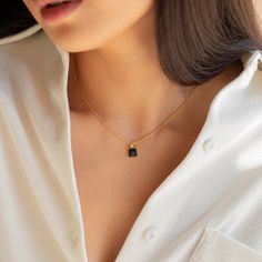 Statement meets simplicity with our beaded Waverly Charm Necklace featuring a dainty black enamel square pendant on a satellite chain and adjustable lobster claw clasp closure. Pair with jeans or your favorite skirt and you have a go-to outfit piece. Material: High Quality Solid 925 Sterling Silver Finish: Sterling Silver ∙ 18K Gold Featuring an ~8mm Black Enamel Square Pendant, with a satellite chain - adjustable length 16 inches to 18 inches SKU: RR-NR106 Everyday Charm Necklace With Square Pendant And Adjustable Chain, Chic Black Jewelry For Everyday Use, Chic Black Everyday Jewelry, Black Pendant Charm Necklace, Delicate Chain Charm Necklace With Square Pendant, Rectangular Charm Necklaces For Everyday, Black Pendant Charm Necklace For Everyday, Everyday Black Pendant Charm Necklace, Black Square Pendant Necklace For Everyday