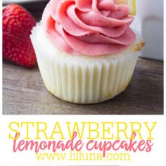 strawberry lemonade cupcakes with fresh strawberries in the background and text overlay reading strawberry lemonade cupcakes