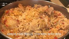 chicken and rice is cooking in a pan on the stove with words arroz con pollo chicken with rice