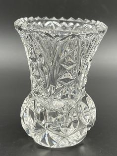 a clear glass vase sitting on top of a table