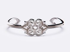 Introducing this exquisite Silver Cuff from the Fleur Romance Collection by Christopher Peter Designer Jewellery. Crafted by the artisan himself, this stunning piece embodies love and devotion with its elegant Fleur De Lis flowing into the embrace of a heart. Made from 925 sterling silver, this bracelet reflects the timeless beauty and sophistication of French Neo-Classical design from the age of enlightenment. Perfect for any occasion, this handcrafted masterpiece is a symbol of enduring romanc Elegant Engraved Cuff Bracelet For Formal, Elegant Engraved Cuff Bracelet For Formal Occasions, Classic Formal Cuff Bracelet With Intricate Design, Classic Intricate Cuff Bracelet For Formal Occasions, Elegant Cuff Bracelet With Intricate Design For Formal Events, Elegant Cuff Bracelet With Intricate Design For Formal Occasions, Elegant Engraved Bangle, Elegant Formal Cuff Bracelet, Luxury Formal Cuff Bracelet With Intricate Design