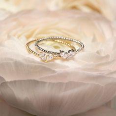 A modern and chic tiny heart design. Wear alone for a minimal look or stack with our other designs as pictured. Colors in: .925 Sterling Silver / Gold Vermeil Hypoallergenic, lead, and nickel free Heart Width: 5.5mm x Height:3.5mm Rope Band: 1mm #R098 Dainty Hypoallergenic Heart Ring, Dainty Stackable Heart Ring In White Gold, Dainty Stackable White Gold Heart Ring, Dainty White Gold Stackable Heart Ring, Dainty White Gold Heart Cut Heart Ring, Dainty White Gold Heart Ring, Delicate Stackable Heart Promise Ring, Dainty Sterling Silver Stackable Rings With Heart Charm, Elegant Sterling Silver Heart Ring For Everyday