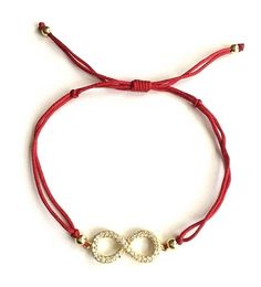 18k gold plated over 925 silver infinity bracelet .adjustable . for eternity,empowerment and everlasting love. --comes with free gift pouche. pulsera de infinito en 925 plata con baño de oro.rojo hilo. ajustable. para eternidad,empoderamiento y amor eterno. --gratis bolsa de regalo. Red Bracelet With Adjustable Chain As Gift, Red Bracelet With Adjustable Chain For Gift, Adjustable Gold Plated Charm Bracelets, Adjustable Gold Plated Bracelets With Charms, Dainty Adjustable Red Bracelet, Dainty Red Adjustable Bracelet, Elegant Red Bracelets For Good Luck, Gold Jewelry With Adjustable Cord For Valentine's Day, Adjustable Bracelets As Gift For Her