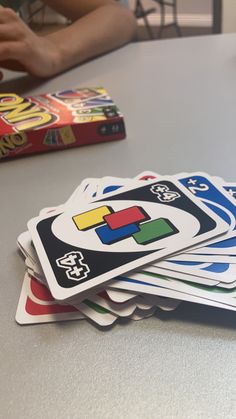 a stack of cards sitting on top of a table