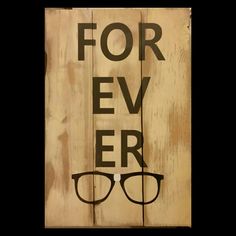 a wooden sign that says for ever with glasses on it and the words'for ever'written in black