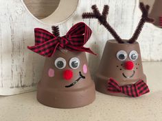 two chocolate cups decorated to look like reindeers