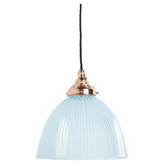 a blue glass pendant light hanging from a black cord on an isolated white wall or ceiling