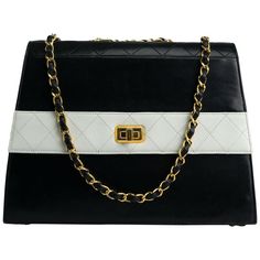 Chanel 1980s Two Tone Black and White Vintage Flap Bag | From a unique collection of rare vintage Structured Shoulder Bags at https://www.1stdibs.com/fashion/handbags-purses-bags/shoulder-bags/structured-shoulder-bags/. Black And White Bags, Chanel Black And White, Vintage Chanel Bag, Black And White Vintage, Vintage Chanel Handbags, Vintage Crossbody Bag, Gold Bag, Chanel Purse, Vintage Purses