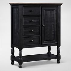 a black cabinet with drawers and wheels on the bottom shelf is against a white background