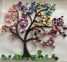 a tree made out of buttons on a white board