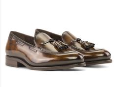 Step into unparalleled sophistication with our Handcrafted Tobacco Patina Loafers, a testament to the timeless elegance of traditional English craftsmanship. Key Features: Materials: Tobacco Patina leather exterior, exuding a rich and distinctive aesthetic. Sole: Brown Goodyear Welt Leather Sole, ensuring durability and a touch of classic charm. Last: Zurigo Last, presenting a rounded toe for that quintessential traditional English look. Artisan-Hand Made Patina: The Anticatura technique, master Timeless Italian Dress Shoes For Galas, Luxury Plain Toe Tassel Loafers For Formal Occasions, Luxury Tassel Loafers With Plain Toe For Formal Occasions, Luxury Formal Tassel Loafers With Plain Toe, Luxury Brown Tassel Loafers For Semi-formal Occasions, Luxury Brown Tassel Loafers For Semi-formal, Brown Luxury Tassel Loafers For Formal Wear, Brown Luxury Tassel Loafers For Formal Occasions, Luxury Tassel Loafers With Leather Sole For Formal Occasions