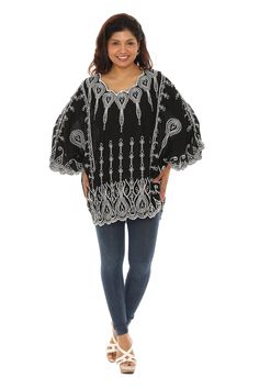 Stay comfy as can be in this soft and relaxed cape-sleeve top featuring intricate embroidery for a boho vibe. Size S/M: 32'' long from high point of shoulder to hem 100% rayon Machine wash Oversized Embroidered Cotton Blouse, Embroidered Long Sleeve Fall Poncho, Fall Long Sleeve Embroidered Poncho, Bohemian Long Sleeve Embroidered Poncho, Flowy Bohemian Embroidered Top, Bohemian Batwing Sleeve Poncho For Spring, Embroidered Long Sleeve Poncho For Festival, Bohemian Flowy Embroidered Blouse, Oversized Embroidered Summer Blouse