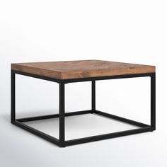 a square wooden table with black metal frame and wood top, on a white background