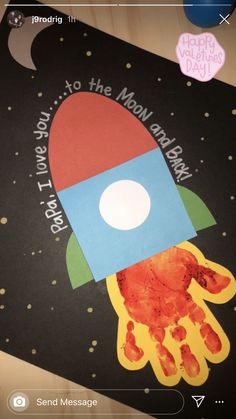 a handprinted rocket ship with the words happy father's day on it