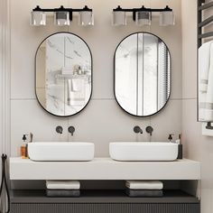 two round mirrors are above the double sinks in this modern bathroom with marble countertops