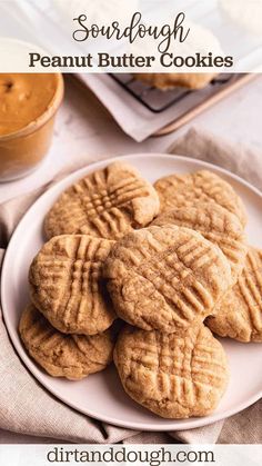 peanut butter cookies on a white plate with text overlay that reads, sourdough peanut butter cookies