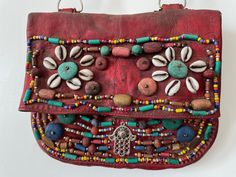 Handmade vintage Moroccan Berber Leather bag with beads  26 x 22 cm Handmade Festival Pouch Bags, Handmade Brown Vintage Pouch, Vintage Handmade Brown Pouch, Vintage Red Handmade Satchel, Handmade Vintage Red Satchel, Vintage Handmade Red Satchel, Bohemian Red Beaded Shoulder Bag, Handmade Vintage Pouch Satchel, Red Bohemian Beaded Shoulder Bag