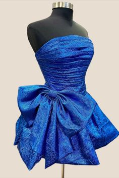 2024 Royal Blue Short Homecoming Dress Blue Corset Dress For Gala During Prom Season, Strapless Dress With Bow Tie Back For Gala, Blue Ruffles Fitted Bodice Mini Dress, Glamorous A-line Fitted Corset Dress, Blue Mini Dress With Ruffles And Fitted Bodice, Strapless Mini Dress With Detachable Bow For Evening, Blue Corset Party Dress With Ruched Bodice, Elegant Evening Corset Dress With Bow, Blue Party Corset Dress With Ruched Bodice