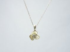 Gold flower necklace- simple dainty necklaceThree petal flower charm hangs on a dainty 14K gold filled chain.  Simple and dainty jewelry, a great everyday necklace.>>>measurements<< Tiny Delicate Pendant Charm Necklace, Delicate Flower Charm Necklaces For Everyday, Delicate Necklace With Flower Charm, Everyday Delicate Flower Charm Necklaces, Delicate Flower Pendant Necklace, Everyday Delicate Flower Charm Necklace, Delicate Yellow Gold Charm Necklace, Dainty Flower Necklace With Delicate Chain, Delicate Tiny Charm Necklace In 14k Gold