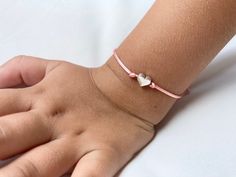 The First Day of School is a big, scary step for some little ones. Make the first day a little less hard with these adorable Mommy and Me heart bracelets. Perfect for the first day of preschool, kindergarten, first grade, daycare, or camp. You will receive two bracelets - a larger size for mom (or dad) and a smaller size for your little one. Bracelets are easily adjustable to fit any wrist size. Bracelets are made out of nylon satin silk cord and a silver metal heart. Bracelet card can be person Playful Adjustable Name Bracelet For Gift, Playful Adjustable Friendship Bracelets For Gifts, Playful Adjustable Friendship Bracelets As Gift, Adjustable Pink Bracelets For Playtime, Adjustable Pink Bracelet For Playtime, Pink Adjustable Bracelet For Playtime, Adjustable Playful Heart Bracelet As Gift, Handmade Adjustable Heart Bracelet For Birthday, Handmade Adjustable Heart Bracelet For Birthdays