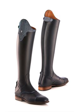 a pair of black riding boots with zippers