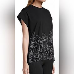 Sports Illustrated Top Black Athleisure T-shirt For Spring, Casual Black Gym Tops, Black Relaxed Fit Top For Gym, Black Relaxed Fit Tops For The Gym, Black Sports T-shirt For Spring, Black Graphic Print Sports Top, Black Graphic Print Athleisure Top, Black Workout T-shirt For Spring, Black Athleisure Tops With Graphic Print