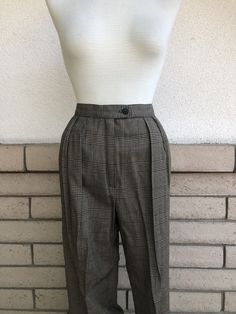 Vintage fantastic 3-piece women's unlined set by Lanz Originals in a soft rayon taupe and black check. Includes oversized blazer with double button closure and shoulder pads. High rise trousers with pleated front and angled side pockets. Midi length high waist skirt with pleated front, back zipper and button closure, side seam pockets. Excellent vintage condition with no sign of wear! label: Lanz Originals fabric: 100% rayon size: *NOTE: this set is sized slightly different. Please check measure Chic Fitted Plaid Bottoms, Chic Fitted Lined Bottoms, Elegant Tailored Plaid Bottoms, Classic Plaid Bottoms With Pockets, Elegant Fitted Plaid Bottoms, Fitted Bottoms With Houndstooth Pattern, Classic Houndstooth Pattern Bottoms, Fitted Plaid Bottoms For Spring, Elegant Plaid Pants For Spring