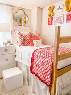 a white and red bedroom with gold accents