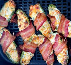 bacon wrapped jalapeno poppers on a grill