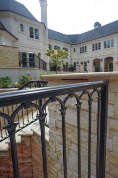 an iron railing in front of a house