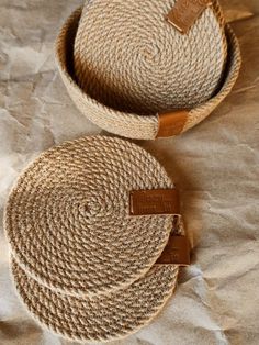 two woven baskets sitting on top of a table