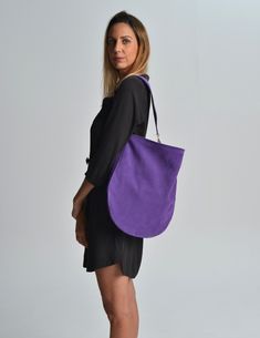 Anna suede purple hobo bag. A beautiful  hobo bag which is ideal for every day use. Not just a shoulder bag but a statetment tote. It's loose minimalistic look makes it modern and unique.  Handmade in our studio from lux italian suede leather in purple color. A leather pocket made from the same leather is included at the interior. Metal details are available in gold or silver. The interior is unlined and has the same look as the exterior. Dimensions: Height, 40 cm (15,75 inches) Length, 41 cm (1 Modern Hobo Bag With Suede Lining For Daily Use, Modern Hobo Bag For Daily Use With Suede Lining, Modern Hobo Bag For Daily Use, Hobo Shoulder Bag With Suede Lining, Everyday Hobo Bag With Suede Lining, Modern Purple Shoulder Bag For Everyday Use, Modern Purple Shoulder Bag For Everyday, Purple Tote Shoulder Bag With Dust Bag, Purple Tote Satchel For Everyday Use