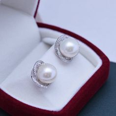 Treat yourself to timeless elegance with these 11-12mm Freshwater Pearl & Rose Floral Earrings from House of Pearls. Classically crafted from freshwater pearls, these earrings exude a classic charm that never goes out of style. The soft, rosy hue of the pearls gives them an added sense of allure, while the simple design keeps them versatile enough to wear it with almost any outfit. Perfect for casual or formal occasions, these timeless studs will add a hint of luxury to any ensemble. This popula Round Akoya Pearl Earrings With Pearl Pendant, Round Akoya Pearl Pendant Earrings, Silver Akoya Pearl Earrings For Gift, Silver Akoya Pearl Earrings As Gift, Round Pearl Clip-on Earrings For Anniversary, Pearl Drop Earrings For Anniversary, Round Pearl Pendant Earrings For Anniversary, Round Pearl White Pearl Earrings For Formal Occasions, Round Pearl White Earrings For Formal Occasions