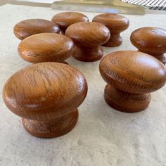 several wooden knobs sitting on top of a counter