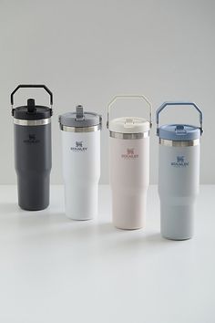 thermos are lined up next to each other