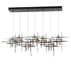 a large rectangular chandelier with multiple lights hanging from it's ceiling fixture