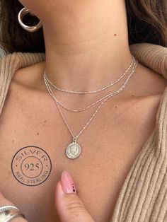 "❤ Welcome to My Store ❤ A very delicate Silver coin necklace with tiny silver dots chain is the perfect necklace for an upgraded daily look. A perfect memory of Queen Elizabeth, whose face is stamped on the coin, Our necklace made of 100% sterling silver !! ♦ Measurements ♦ Necklace length: 16.34\" (41.5 cm) + extra extension 1.2\" (3 cm), The silver coin diameter is 0.6 (1.5 cm). -------------------------------------------------------------- ♦♦ SPECIAL OFFER ♦♦ coin necklace + Two-layer neckla Silver Medallion Coin Necklace With Delicate Chain, Dainty Silver Coin Pendant Necklace, Silver Coin Necklace With Delicate Chain For Gift, Silver Coin Necklace With Delicate Chain, Silver Coin Necklace With Clavicle Chain, Dainty Silver Coin Necklace, Silver Coin Necklace, Medallion Necklace, Silver Coin