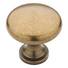 an antique brass cabinet door knob on a white background with clipping for text or image