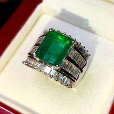 BRAND-NEW!! ONE OF A KIND, HANDCRAFTED RING. EXQUISITE AND FINE CRAFTSMANSHIP! HANDMADE TO LAST FOR AN ETERNITY!! HEIRLOOM PIECE!! PRECIOUS JEWELRY TO BE PASSED ON! PERFECT DRESS RING FOR A GENTLEMAN OR A LADY! 5.04 total carat weight, Certified, Natural emerald ring. This ring offers an important statement of who you are with a 2.88 carats, VIVID DARK GREEN, transparent, ZAMBIAN EMERALD. Accentuating the EMERALD are the 48 SUBSTANTIAL E/VS, sparkling natural diamonds SUGGESTED RETAIL VALUE: $15 Natural Emerald Rings, Emerald Rings, Golden South Sea Pearls, White Gold Earrings Studs, Jewellery Rings, Fancy Rings, Baguette Cut Diamond, Handcrafted Rings, Dress Rings