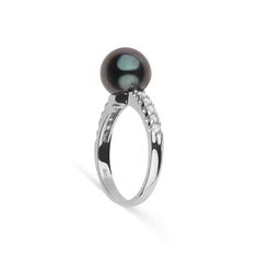 This 9.0-10. mm AAA quality Tahitian pearl ring showcases the pure organic beauty of an exotic Tahitian pearl. The flawless pearl appears to float above the gold, yet is securely attached by a strong post. The classic-style ring features a solid 14-karat gold band that is set with 0.25 carats of diamonds. The ring setting is made in-house and is composed of solid 14 karat gold. We use an extra-fine diamond grade (VS1-G), which is normally reserved for solitaire settings. It's rare to see this gr Anniversary Black Tahitian Pearl Ring, Formal Black Tahitian Pearl Ring, Elegant Tahitian Pearl Ring As A Gift, Classic Tahitian Pearl Rings As Gift, Elegant Tahitian Pearl Ring Gift, Black Tahitian Pearl Ring, Classic White Gold Tahitian Pearl Rings, White Gold Tahitian Pearl Rings For Formal Occasions, Formal White Gold Rings With Tahitian Pearl