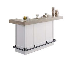 a white kitchen island with two cups on it