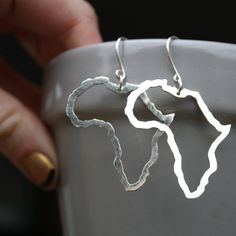 I have sent my ‘African Love’ necklace to customers in all corners of the world, so because this design is such a hit, the natural next step was to make.. earrings!Because who doesn’t Love big bold Africa’s dangling from their ears ?!!!-d e s c r i p t i o n-Completely handmade by me – I sawed the African continent out of sterling silver sheet using my little jewellers saw.  I then sawed another Africa out the middle, leaving a nice & sturdy 2mm thick outline.  The piece was given a shiny brushe Minimalist Pendant Earrings For Everyday, Unique Sterling Silver Hoop Earrings Gift, Modern Sterling Silver Pendant Earrings, Silver Minimalist Pendant Earrings, Minimalist Silver Pendant Earrings, Sterling Silver Pendant Earrings With Ear Wire, Unique Sterling Silver Pendant Earrings, Unique Silver Long Drop Jewelry, Sterling Silver Hypoallergenic Pendant Earrings