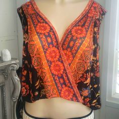 Free People Blouse. Nwt. Orange Black Sheer Printed V-neck Top For Festival, Festival V-neck Printed Top, Festival Floral Print V-neck Top, V-neck Floral Print Top For Festival, Festival V-neck Floral Print Top, Flowy V-neck Blouse For Festival, Flowy V-neck Top For Festivals, Sleeveless Printed Tops For Festivals, Flowy V-neck Top With Boho Print