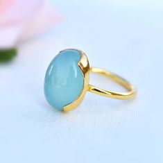 D E T A I L S - Material: Sterling silver 925 Stone: Aqua Chalcedony Stone Shape: Oval Stone Size: 12x16mm The fit: True to US ring size Finish: Smooth and Gold Plated to a high shine S H I P P I N G & P R O D U C T I O N - My current production time is 2-6 business days, which means after those days are up, your order ships! I make everything custom to order, by hand, but I promise you it's worth the wait! R U S H - M Y - O R D E R - If you're in a rush to get your pretty new pieces, please Yellow Gold Chalcedony Ring Gift, Chalcedony Rings Fine Jewelry For Gift, Round Opal Ring As Gift, Anniversary Chalcedony Ring With Polished Finish, Aqua Chalcedony Ring, Ring Everyday, Ring Proposal, Chalcedony Stone, Chalcedony Ring